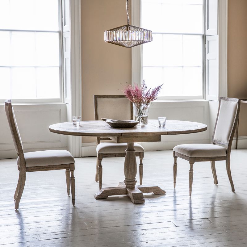 Round light wooden dining table