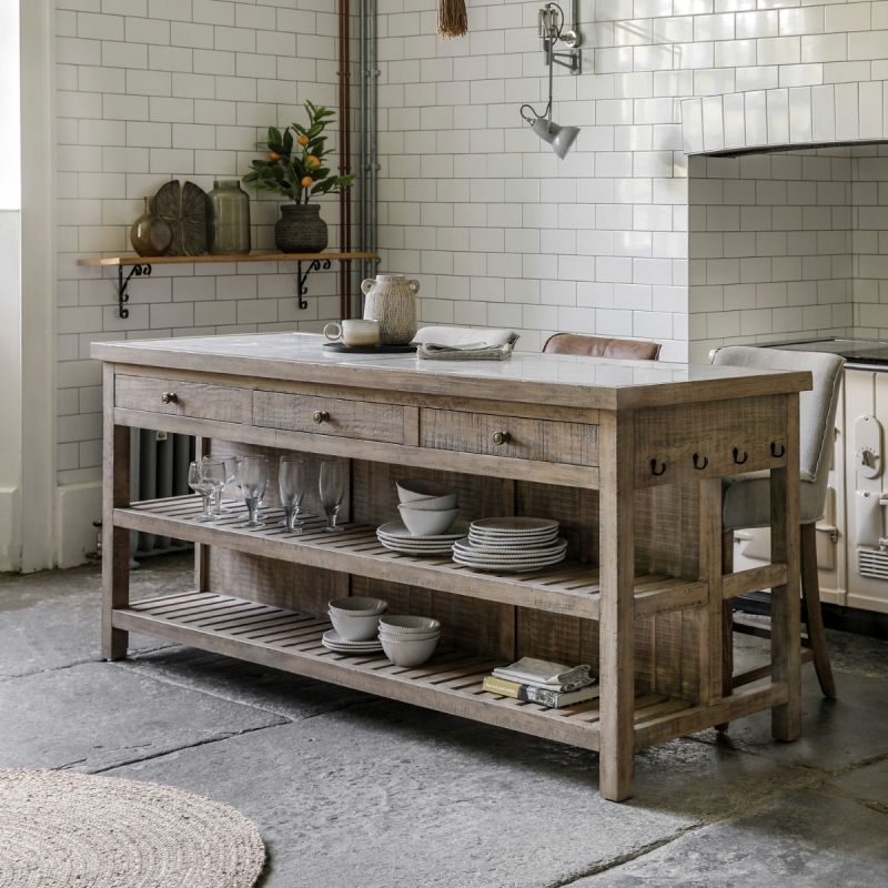 Wooden kitchen island with inset marble slabs on the top, three drawers and two large shelves