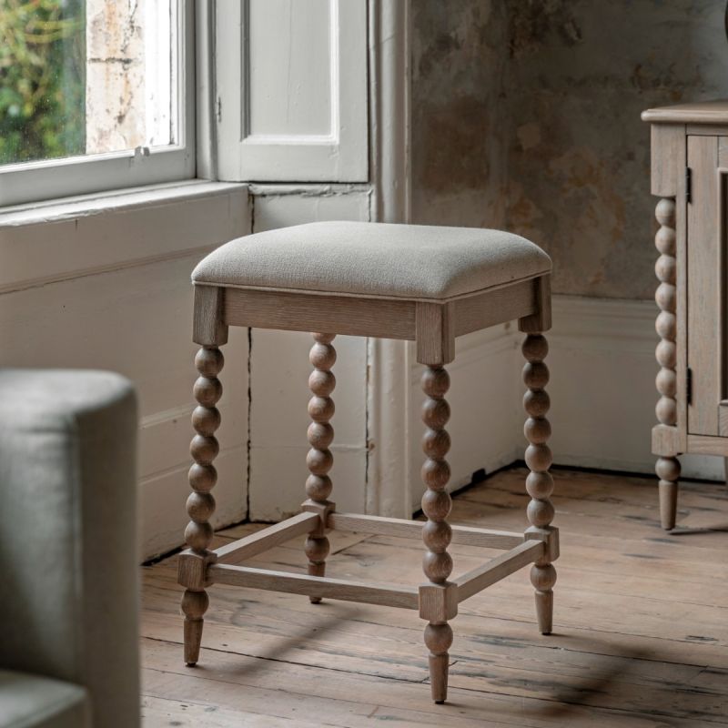 Lime wash wooden bar stool with bobble effect legs