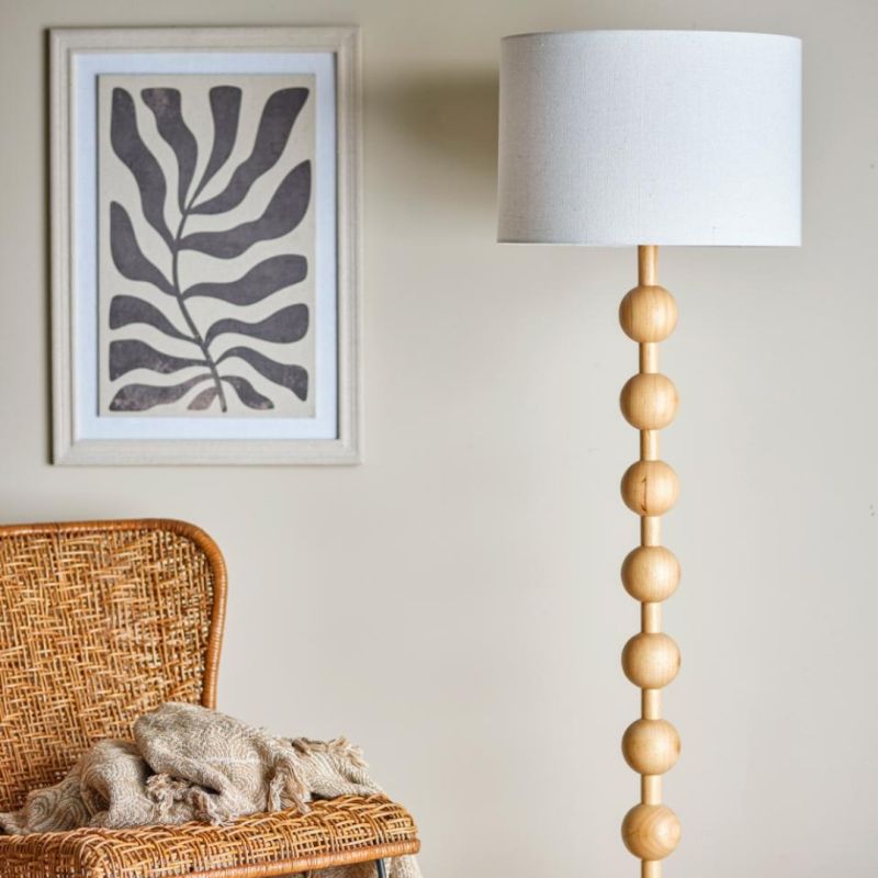 Illuminate your space with the Giacoma Floor Lamp. Its elegant design and warm glow add a touch of style and sophistication to any room.