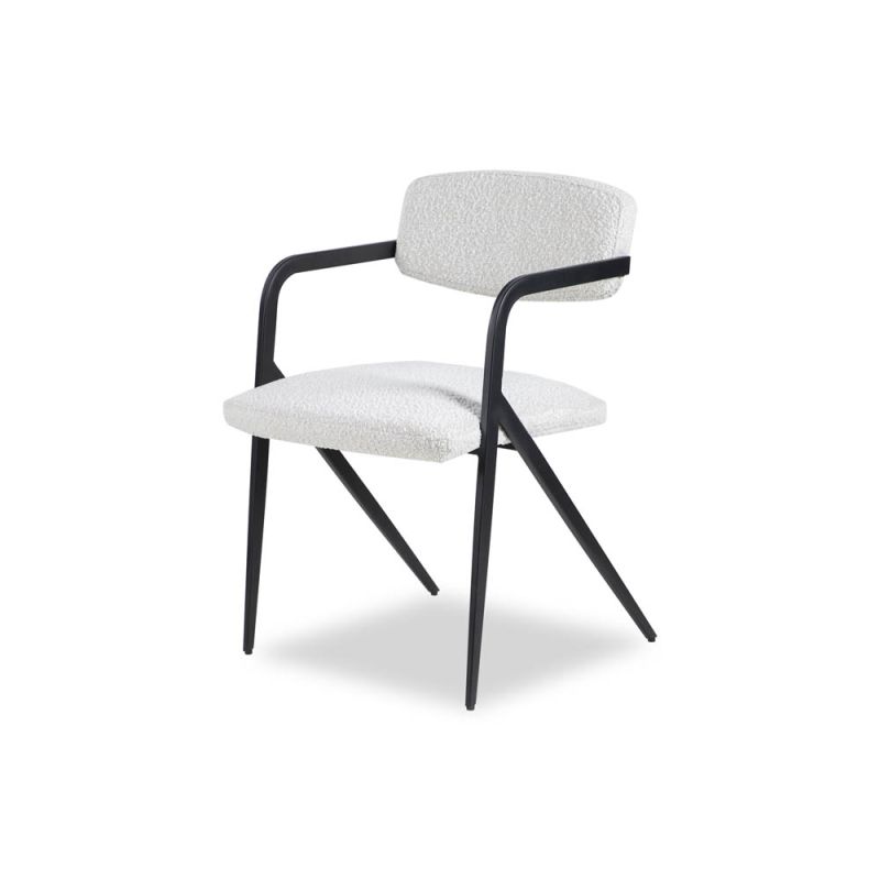 Black frame armchair with slanted back legs and white boucle upholstery