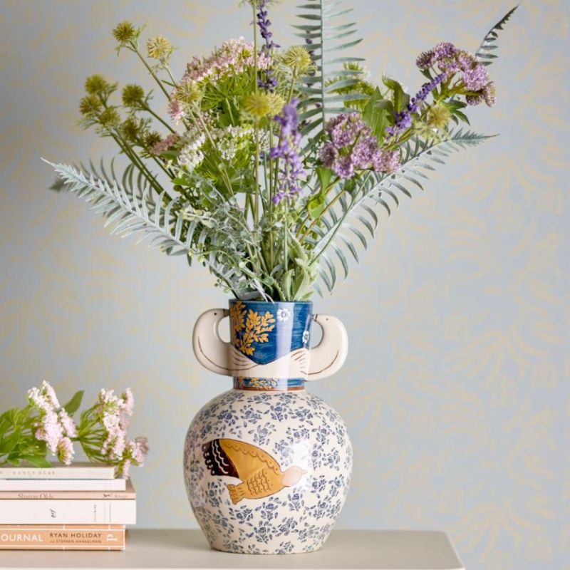 Elevate your space with the Hezha Vase, a stunning blend of modern design and elegance. Perfect for showcasing your favorite blooms or standing alone.
