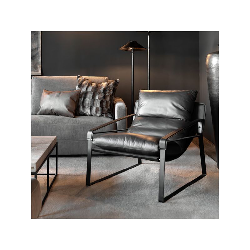 Dark brown leather armchair with black metal frame