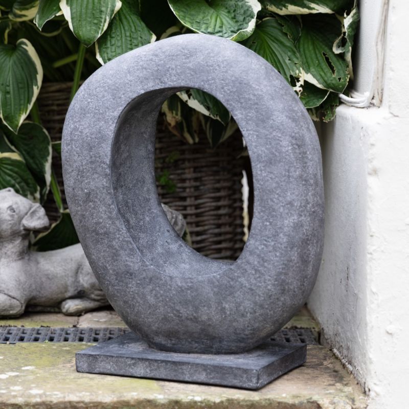 Unusual modernist sculpture in dark grey resin