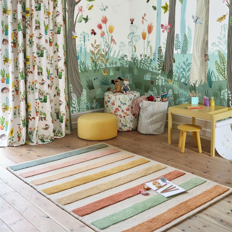 Shop the Villa Nova Candy Cane Rug in Ice Cream. Perfect for adding a playful touch to your space with its vibrant colors and soft texture.