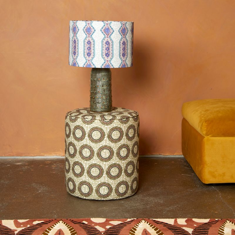 A luxury lampshade by Eva Sonaike with a blue African-inspired pattern