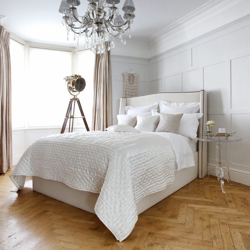 Luxury, French-style bed with small wings and French studding on a sprung slatted base