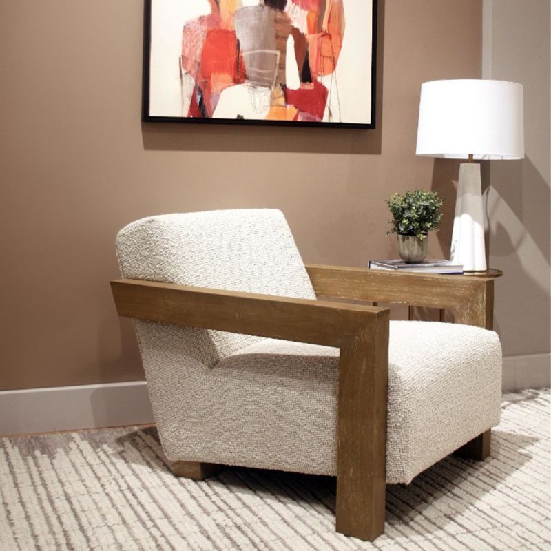 The Abbey Accent Chair, with its solid oak frame and plush cream boucle upholstery, offers both comfort and elegance, making it the perfect addition to any living room.