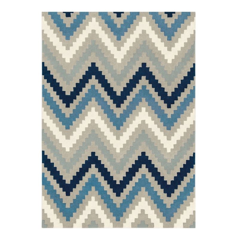 Hand-tufted wool rug with chevron pattern in indigo