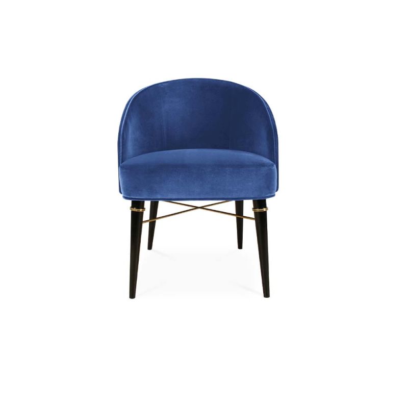A sophisticated dining chair with a luxurious velvet upholstery, lacquered legs and polished brass accents 