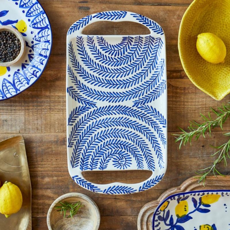 Elevate your hosting game with the Karlie Serving Tray. Stylish and functional, it's perfect for serving drinks and appetizers in any setting.