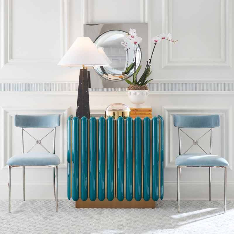 A retro-futuristic inspired cabinet in a teal finish and brass base.