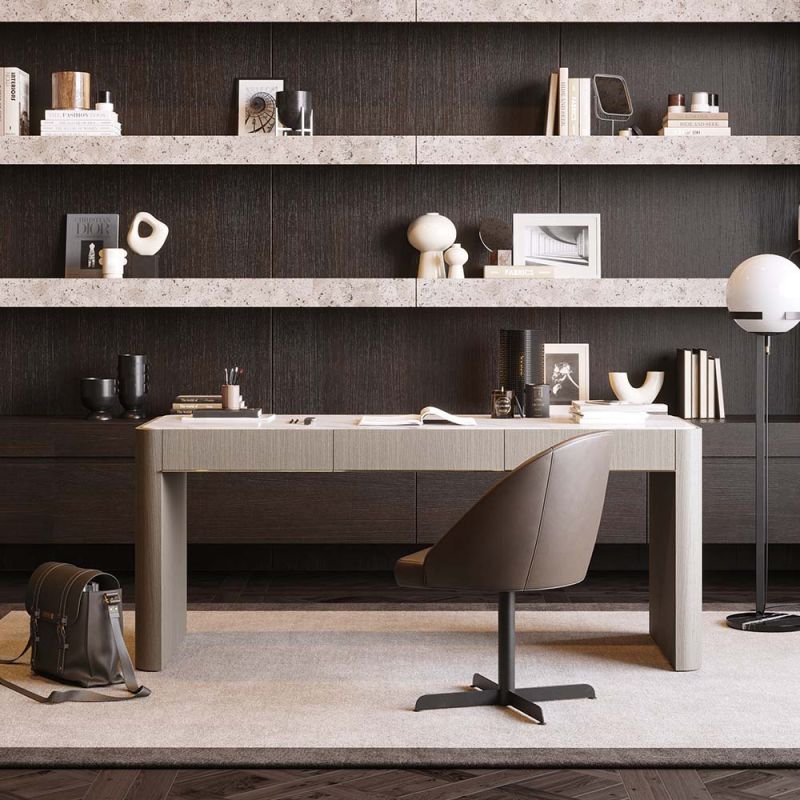 Striking three drawer desk in a grey wood finish with brass accents