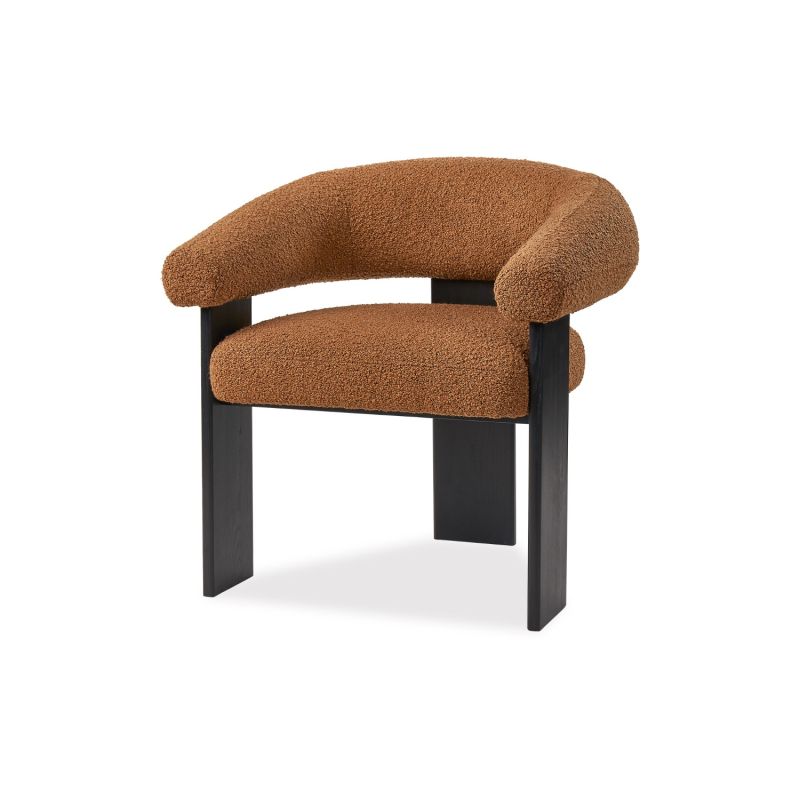 A contemporary armchair by Liang & Eimil with a statement boucle upholstery and stylish black ash wood legs