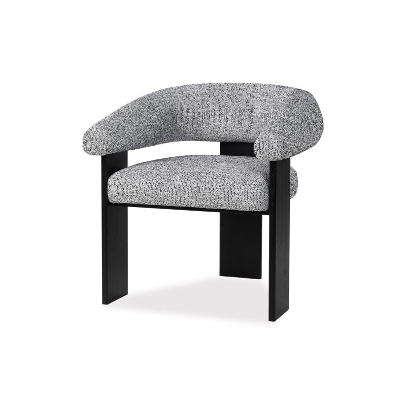 A contemporary armchair by Liang & Eimil with a boucle upholstery and statement legs