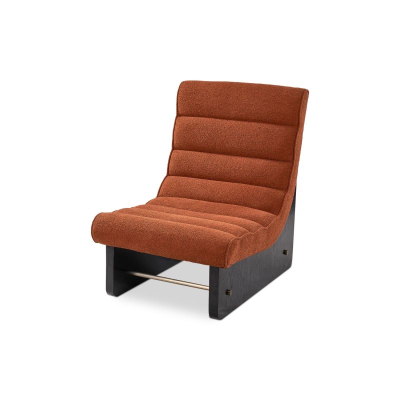 A contemporary chair by Liang & Eimil with a rust upholstery and stylish shape