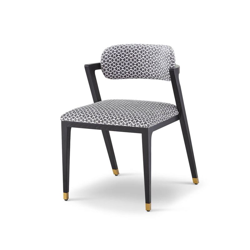 Black and white patterned chair with slanted back legs and brass capped feet