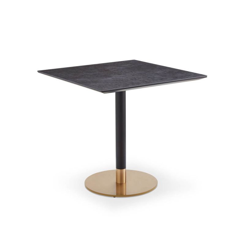 Square dining table with grey top and brass base