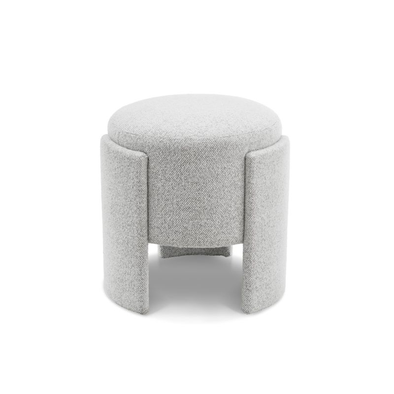 Small round ottoman upholstered in off-white fabric with wide legs overlapping the seat