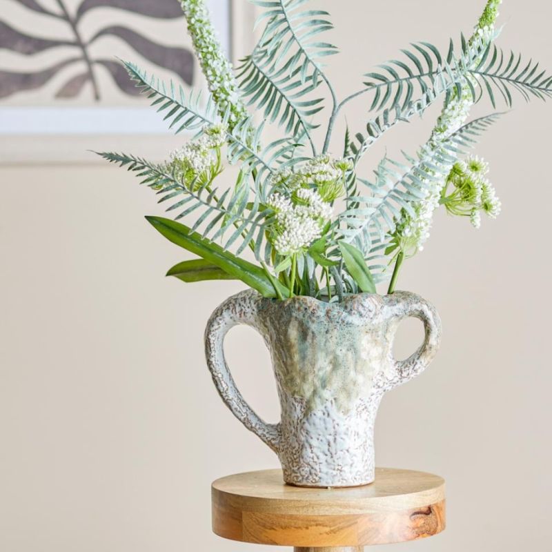Elevate your decor with the Ledger Vase. Its modern design and elegant finish make it perfect for any setting, adding a touch of sophistication.