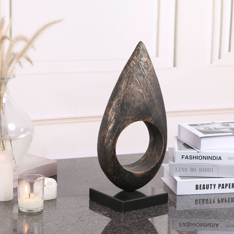 Coffee-coloured marble candle holder with cut-out design