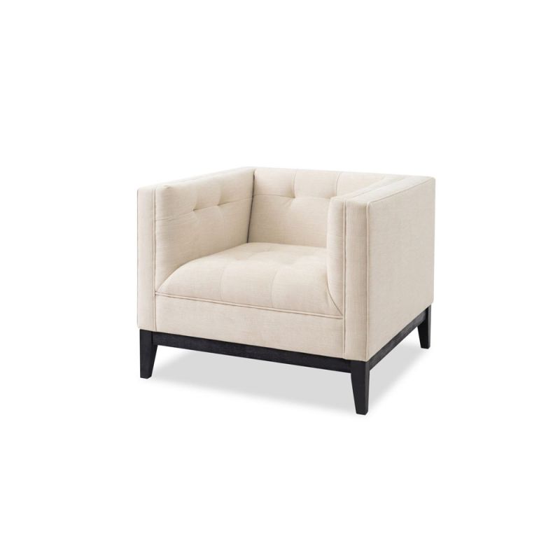 A sophisticated armchair by Liang & Eimil with a neutral upholstery and buttoned design
