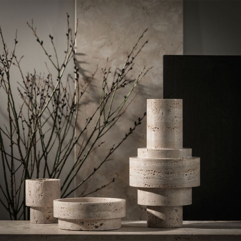 Tall, textured beige marble centrepiece