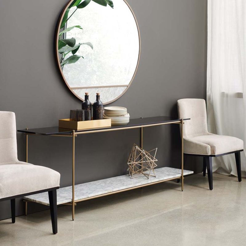 A luxurious contemporary metal and marble console table with a tinted glass top