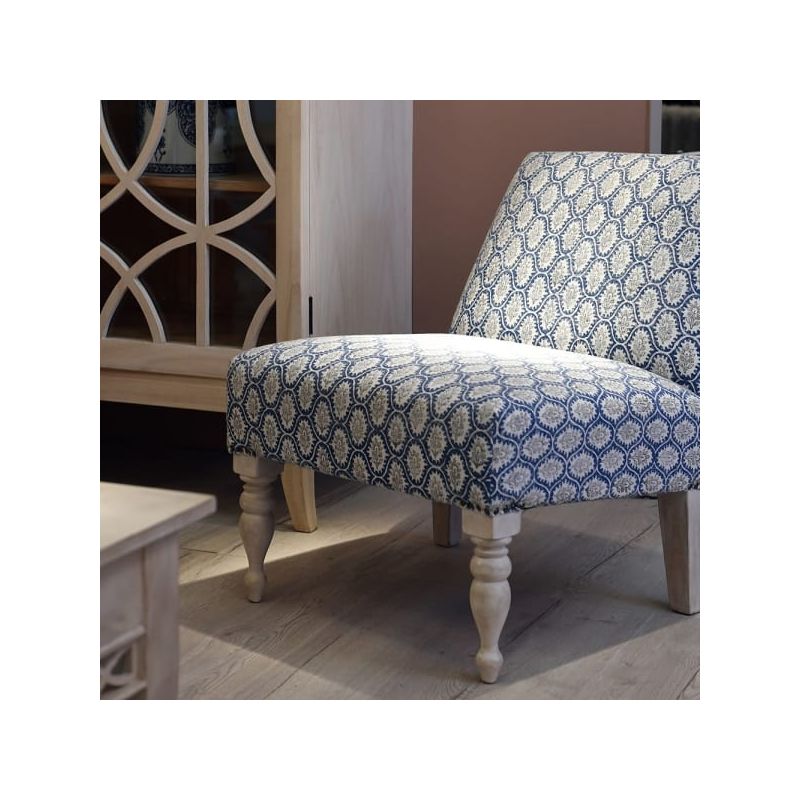 Blue and white patterned chair with relaxed silhouette