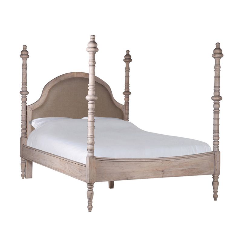 A wooden French-style bed with four posters and linen headboard