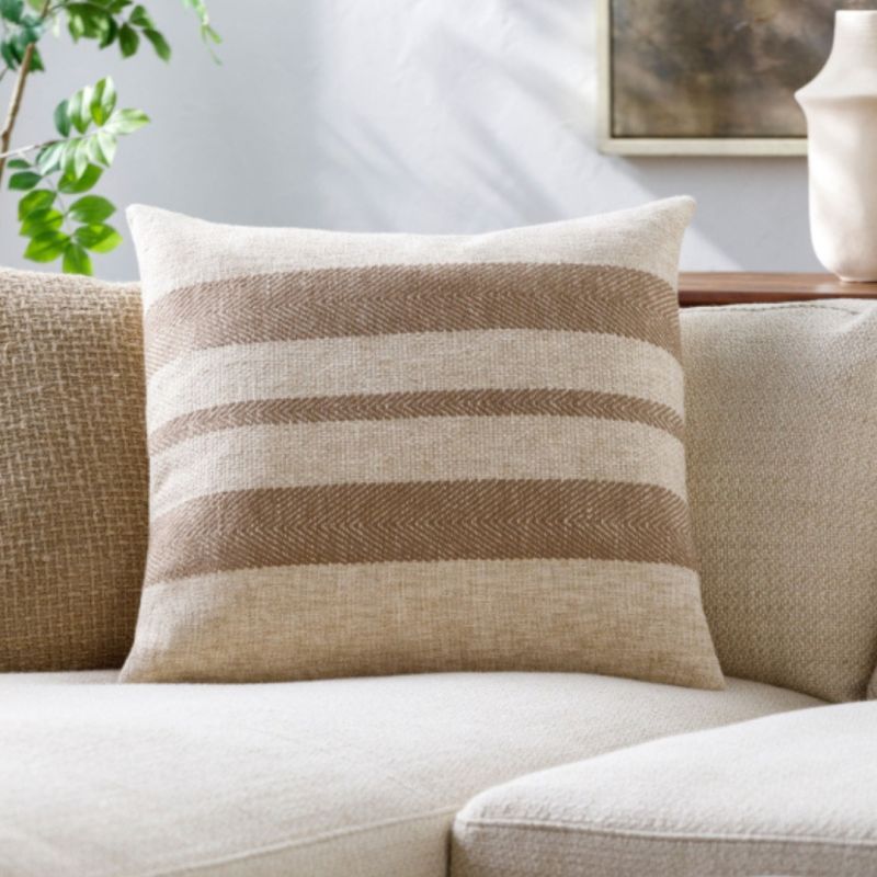 Elevate your space with the Mobley Woven Cushion, featuring a stylish design and plush comfort for a cozy touch to any decor. Perfect for relaxation!