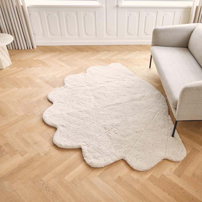 luxuriously cosy shell-shaped sheepskin rug