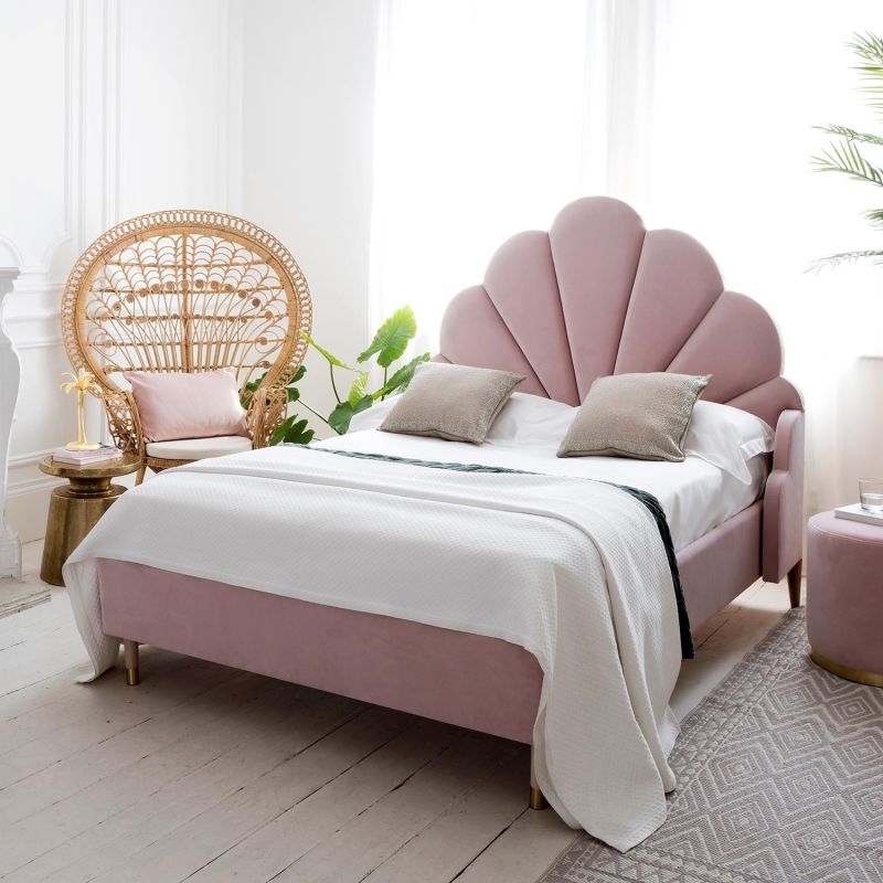 Luxury, curvaceous art-deco bed with a seashell headboard design and tapered legs