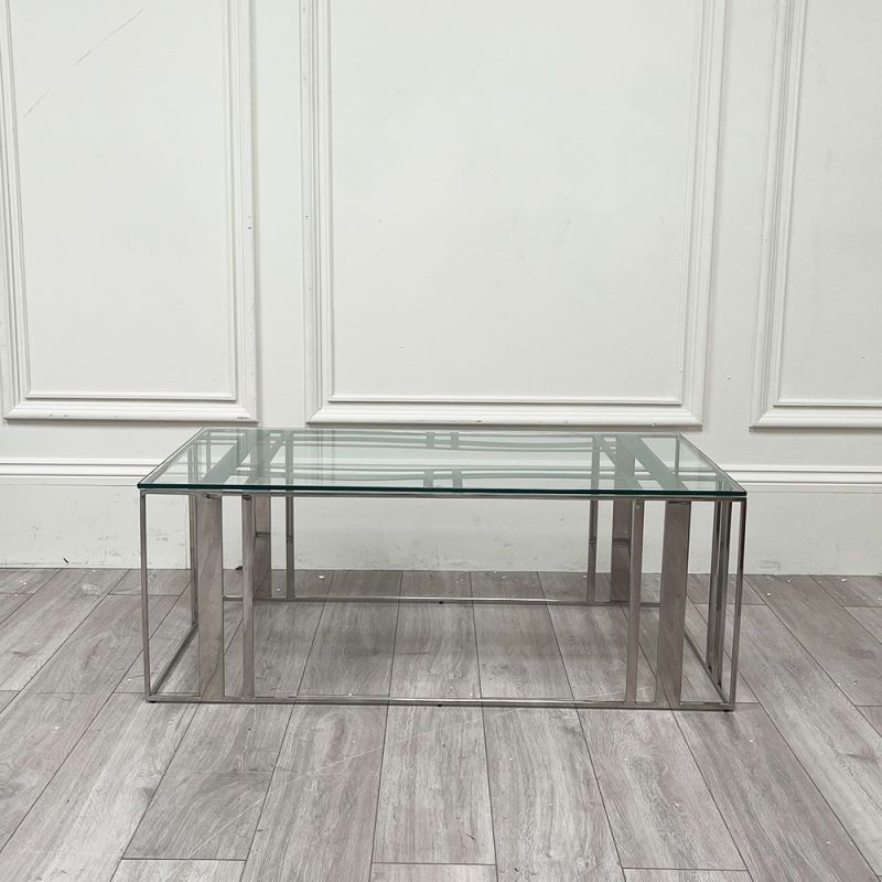 Polished stainless steel coffee table with tempered clear glass surface
