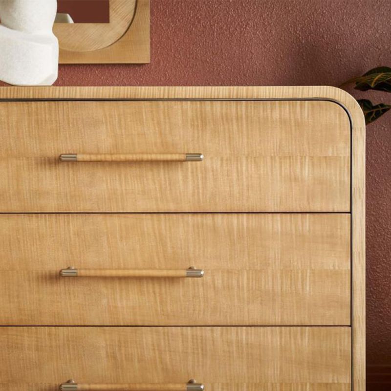 Wooden chest of eight drawers with a rounded silhouette