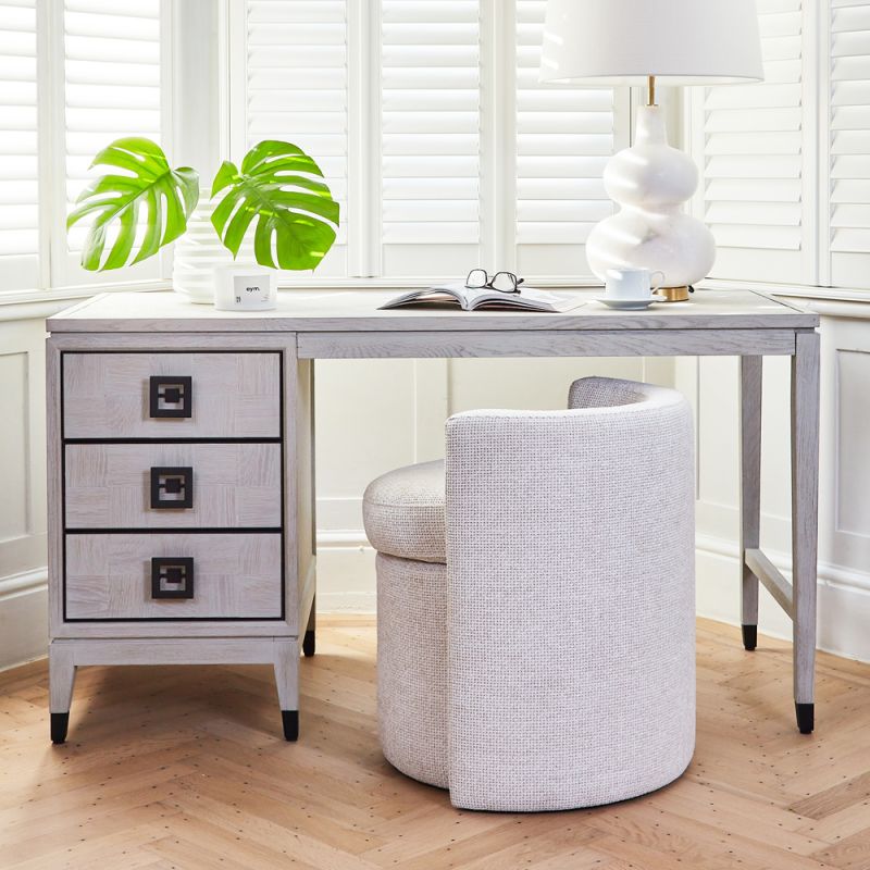 A luxurious white oak and iron desk with spacious storage drawers 