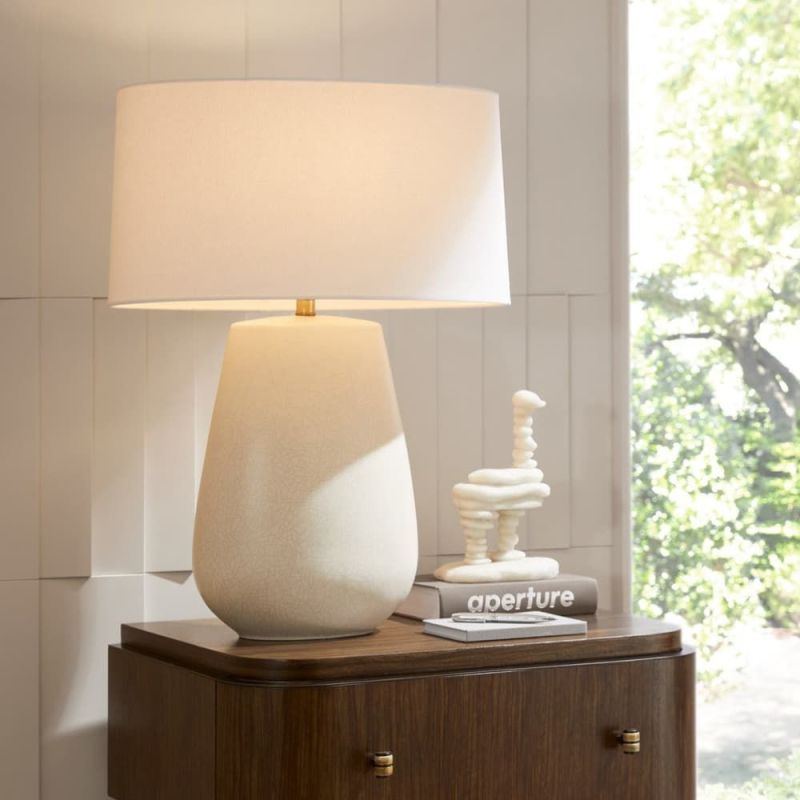 Illuminate your space with the Deagan Side Lamp, blending elegant design and modern functionality for a stylish touch in any room.