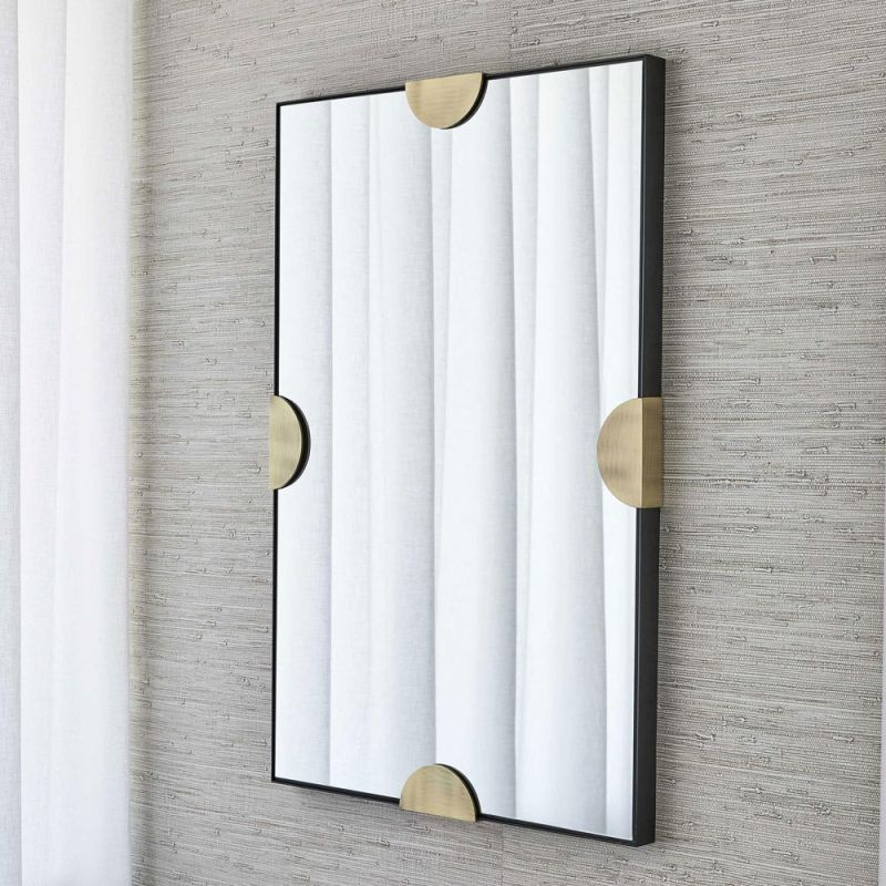 Rectangular wall mirror with black border and brass semi-circle clips 