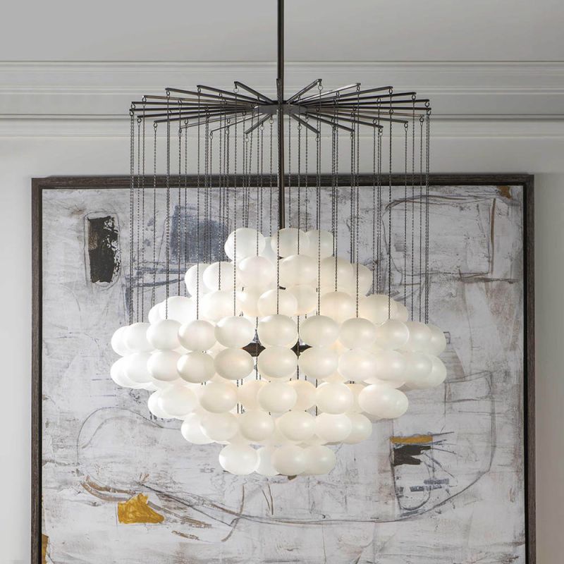Dozens of frosted glass baubles suspended from bronze chains