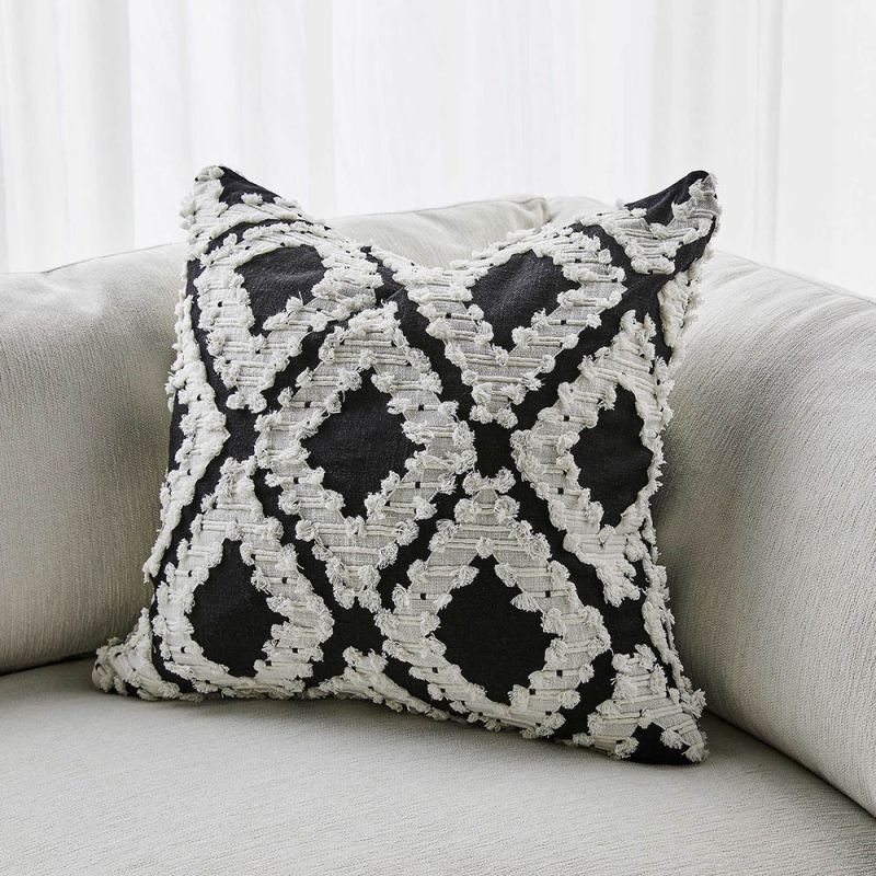 Textured diamond pattern cushion in black and white