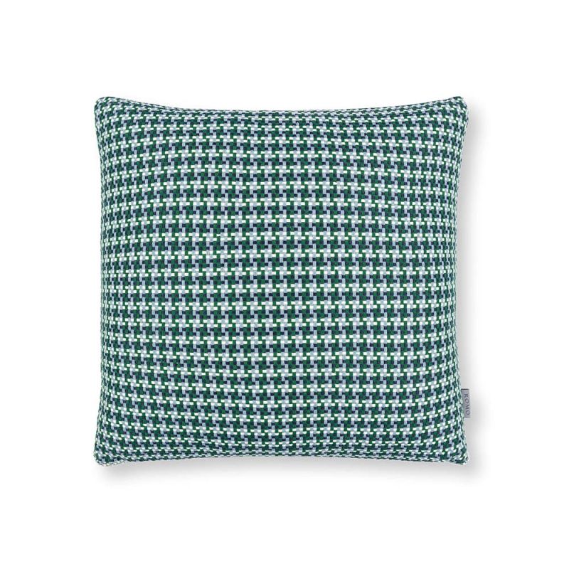 A teal houndstooth inspired outdoor cushion