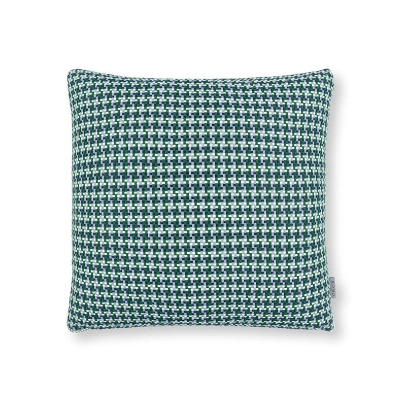 A teal houndstooth inspired outdoor cushion