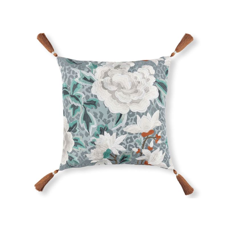 Grey cushion with white flowers and green leaves, brown tassels and leopard print reverse 