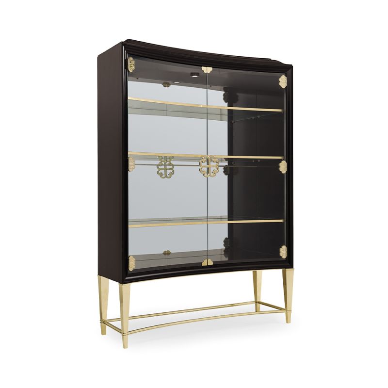 A luxury display cabinet from Caracole with glamorous gold details