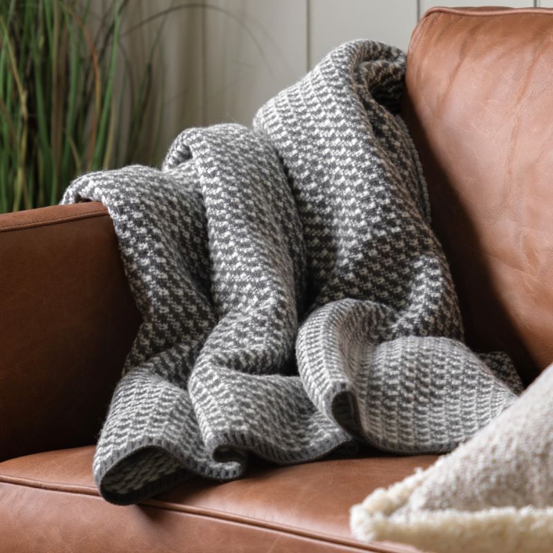 Grey and white cross knit throw