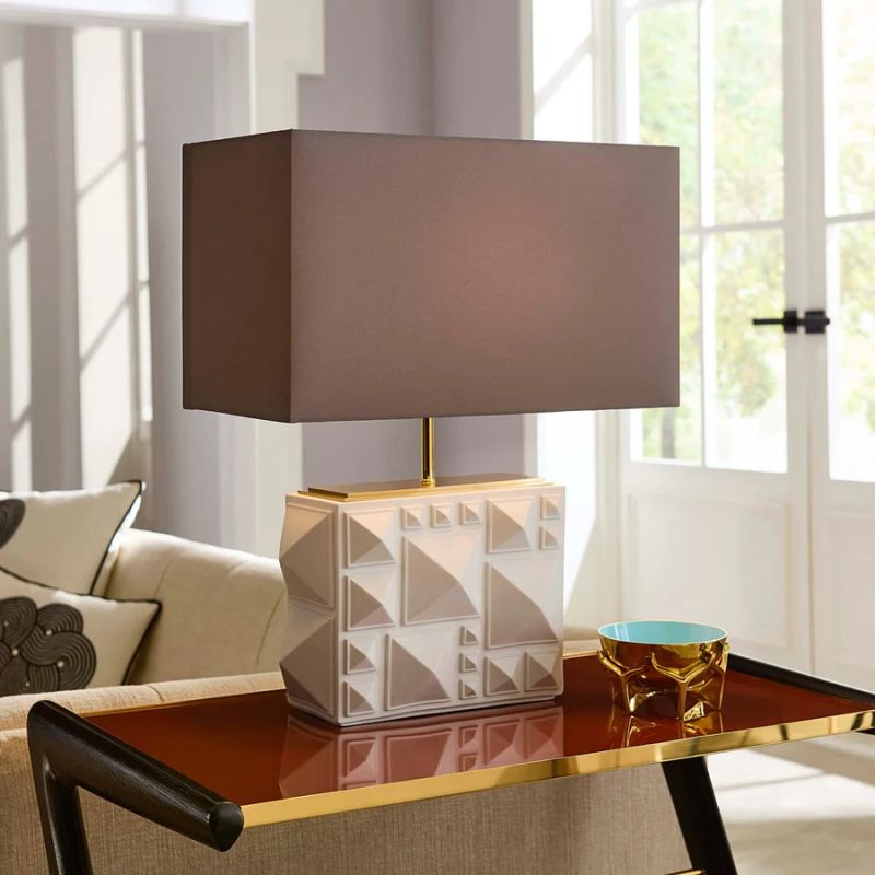 Illuminate your space with the Charade Studded Table Lamp, featuring a chic design and shimmering studs that add a touch of elegance to any decor.