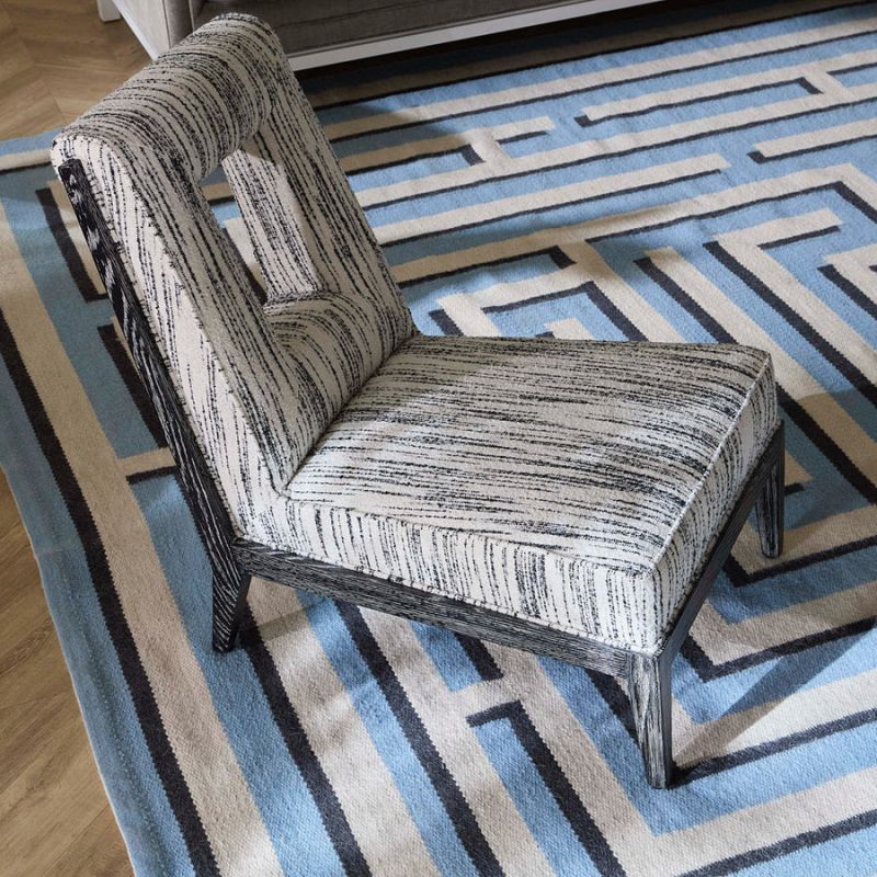 Shop the Cocteau Slipper Chair for elegant comfort. Its chic design and plush upholstery make it a perfect addition to any stylish interior.