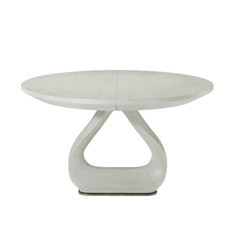 White round table with curvaceous plinth base