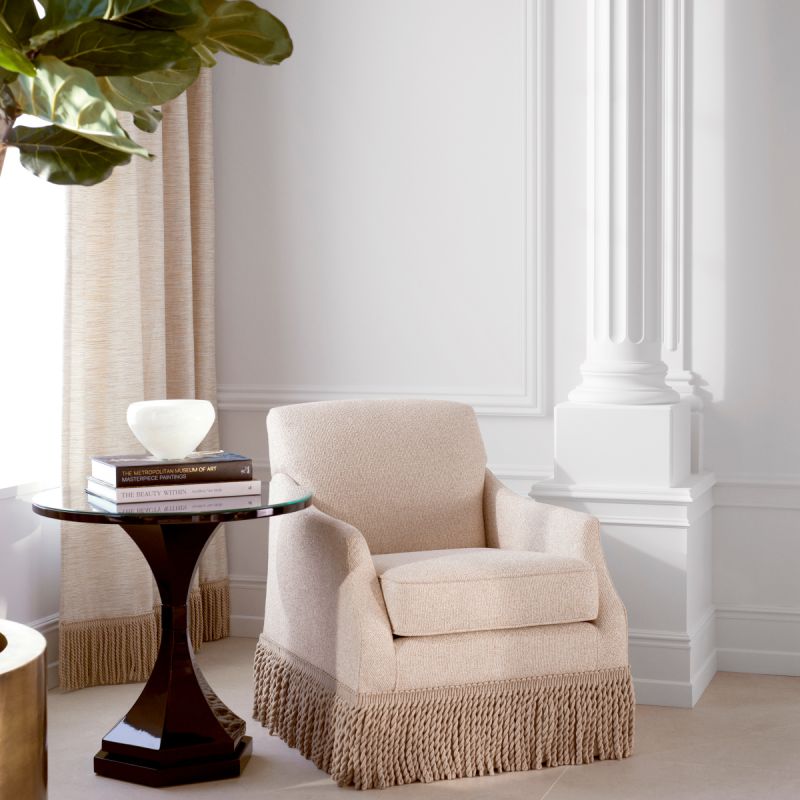 A statement armchair with a 20th century design and swivel base