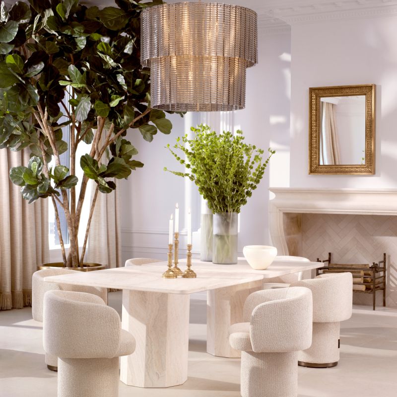 A stylish dining chair with a luxury beige upholstery and unique silhouette